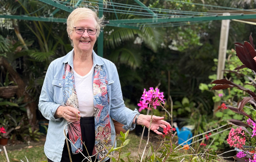 Wendy in the garden of her duplex on the Sunshine Coast