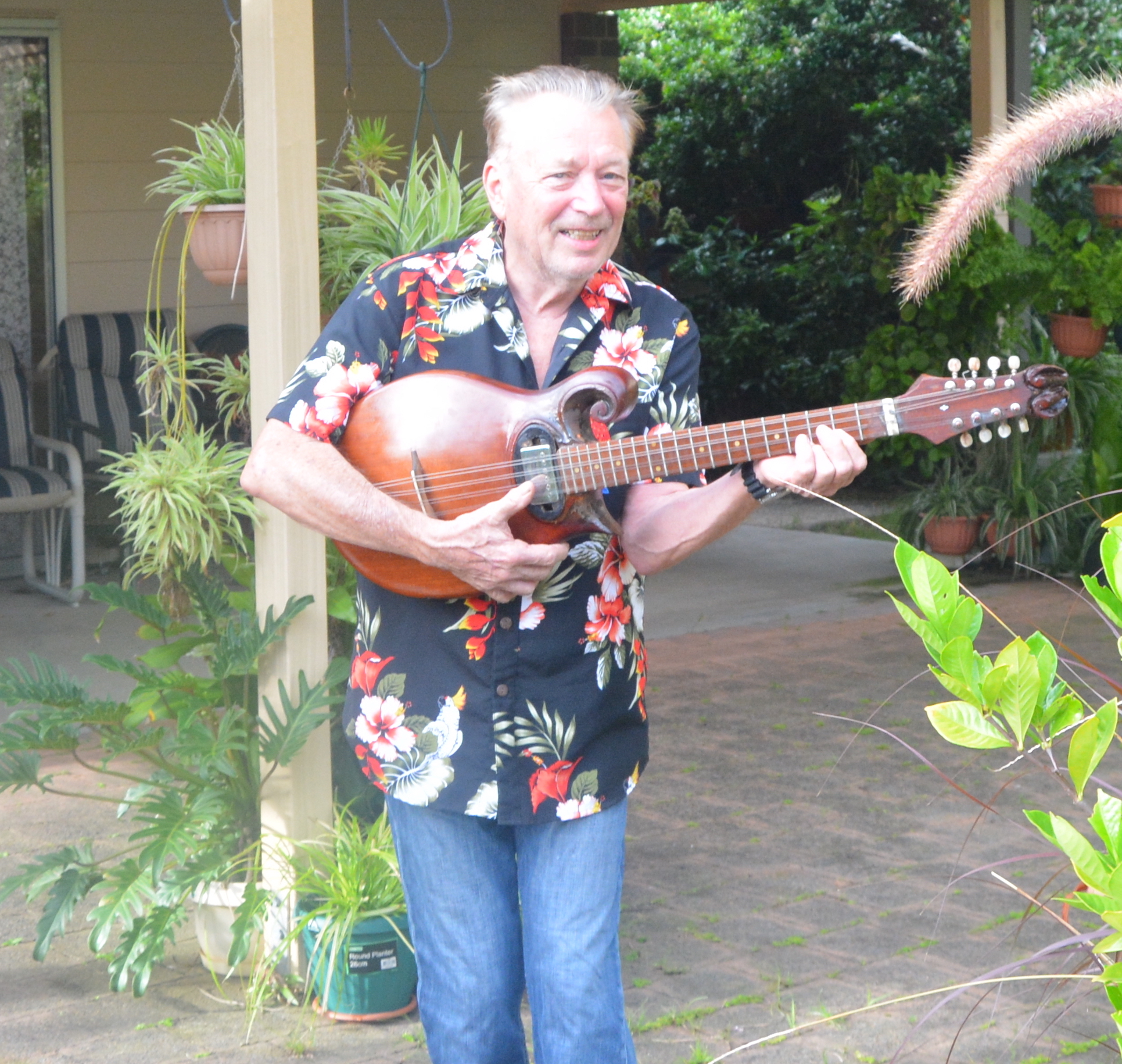 Mick from Bayside Housing Centre playing guitar